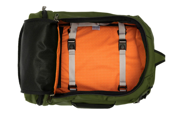 An open Techonaut 30 with a Saguaro (olive green) exterior and an Zest (orange) interior.